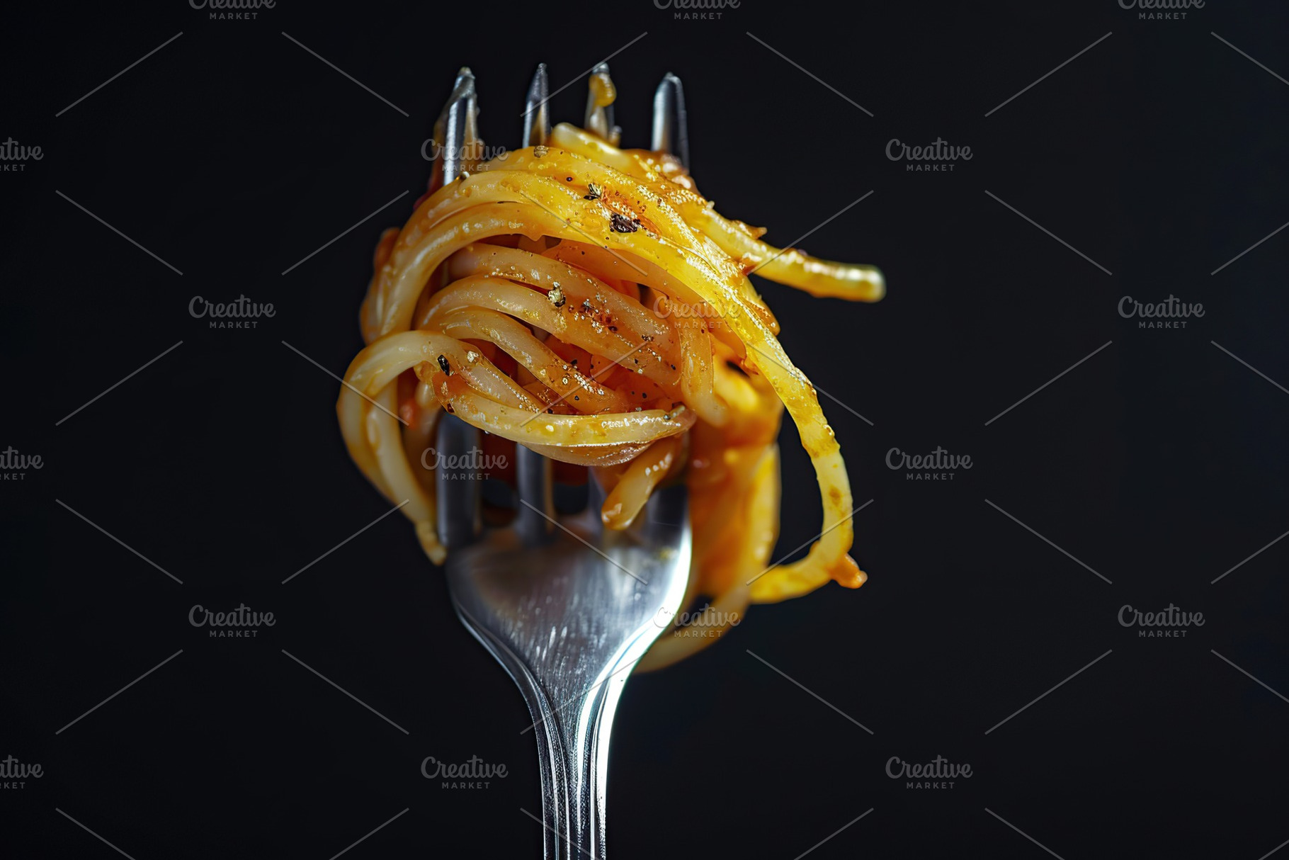 Spaghetti rolled on a fork on black background, a Food & Drink Photo by AlyaAnd