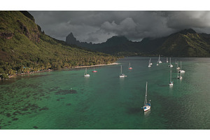 Sailboats anchoring in Opunohu bay, a Transportation Photo by Goinyk