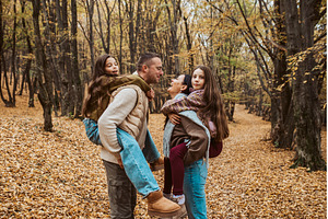 Mother and father kissing while, a Person Photo by HalfPoint