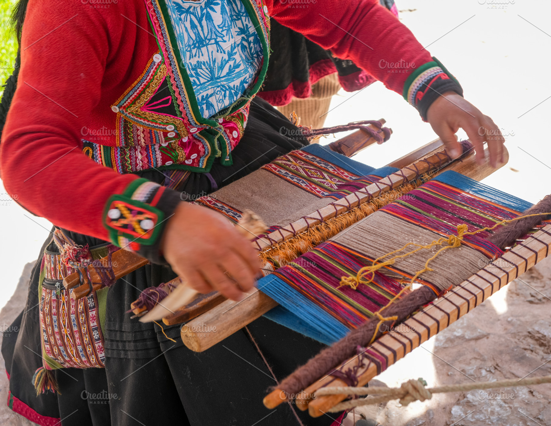 Andean artisan weaving a colorful textile near Cusco, Peru, a Person Photo by GoodGoods