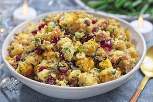 Cranberry pecan cornbread dressing for poultry or meat stuffing, in bowl, horiz, a Food & Drink Photo by iuliia_n