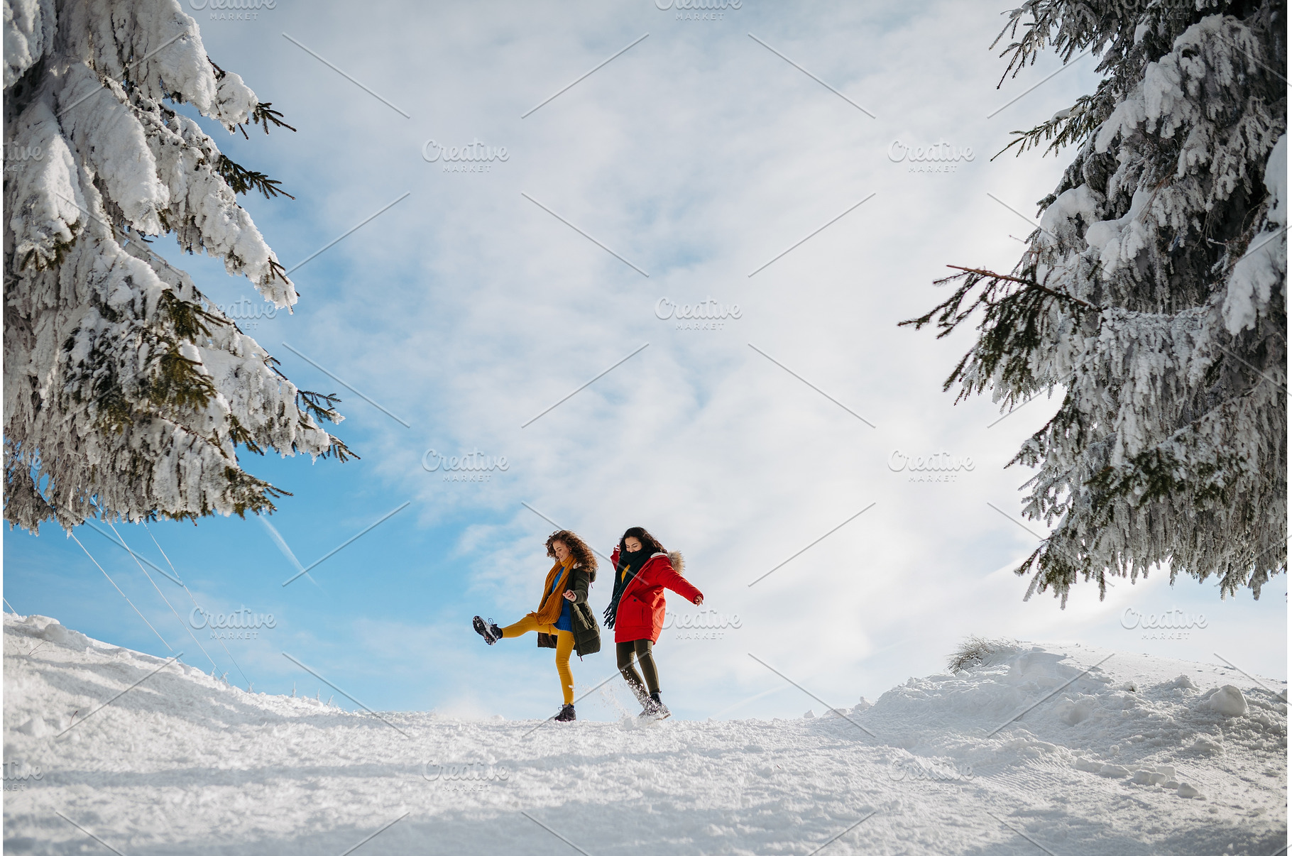 Two female friends walking in winter, a Sports & Recreation Photo by HalfPoint