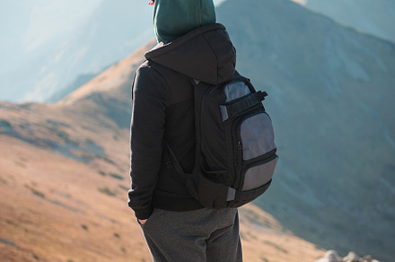 Young man  looking away in front of mountain on sunny day., a Person Photo by Olena Rudo