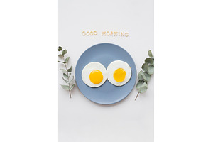two beautiful eggs on a plate, a Food & Drink Photo by Artsaba Family