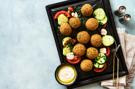 fried in oil falafel with cucumber-tomato salad and yoghurt with, a Food & Drink Photo by IriGri