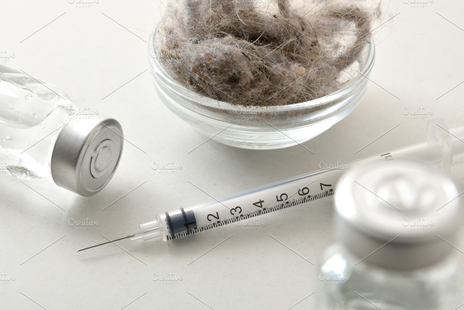 Syringe on a white table with vaccines elevated view, a Health & Medical Photo by Davizro's Market