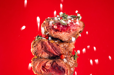 Pieces of beef steak on fork, a Food & Drink Photo by Rimma