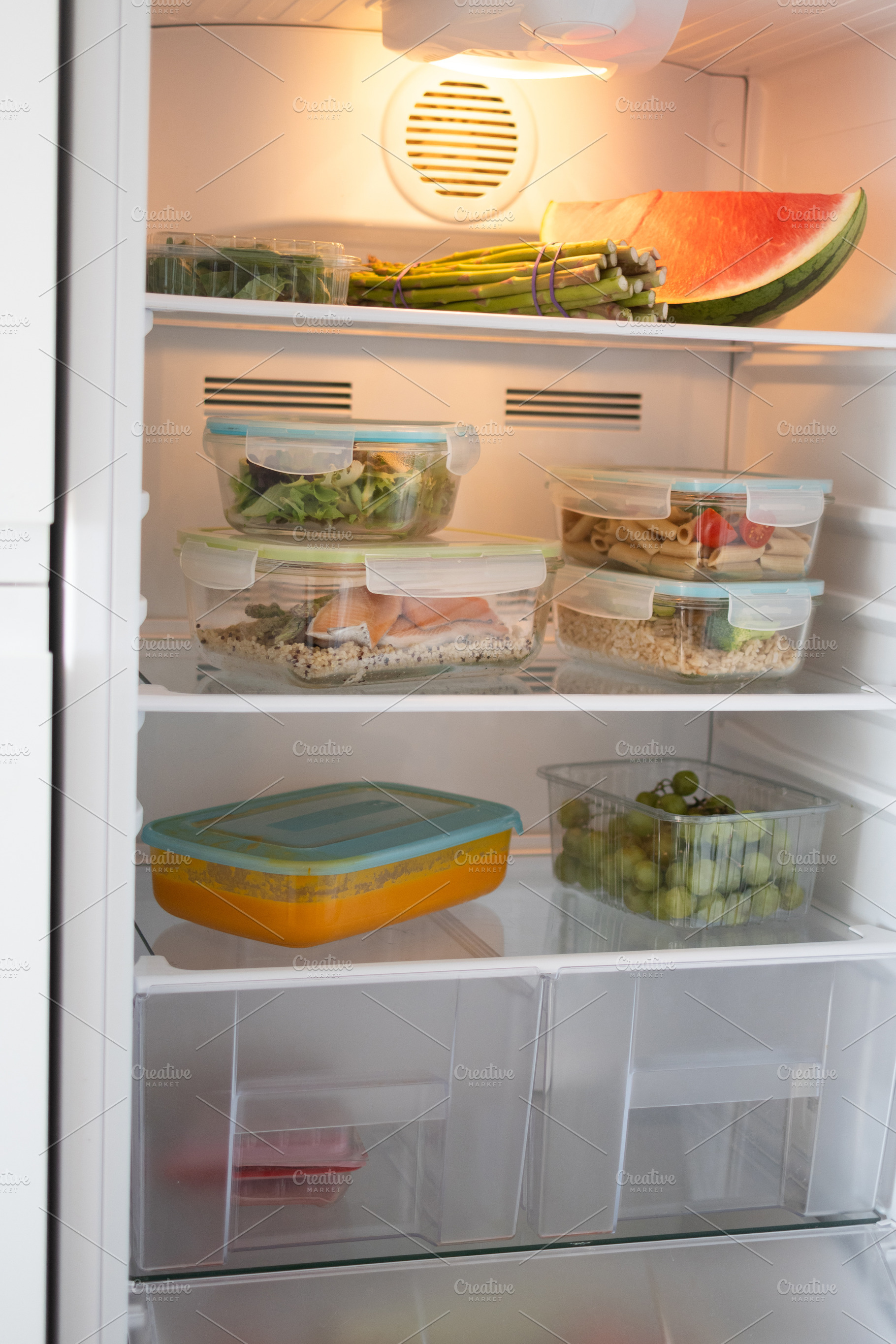 Organized Refrigerator with Healthy Meal Prep Containers and Fresh Food, a Food & Drink Photo by etorres69