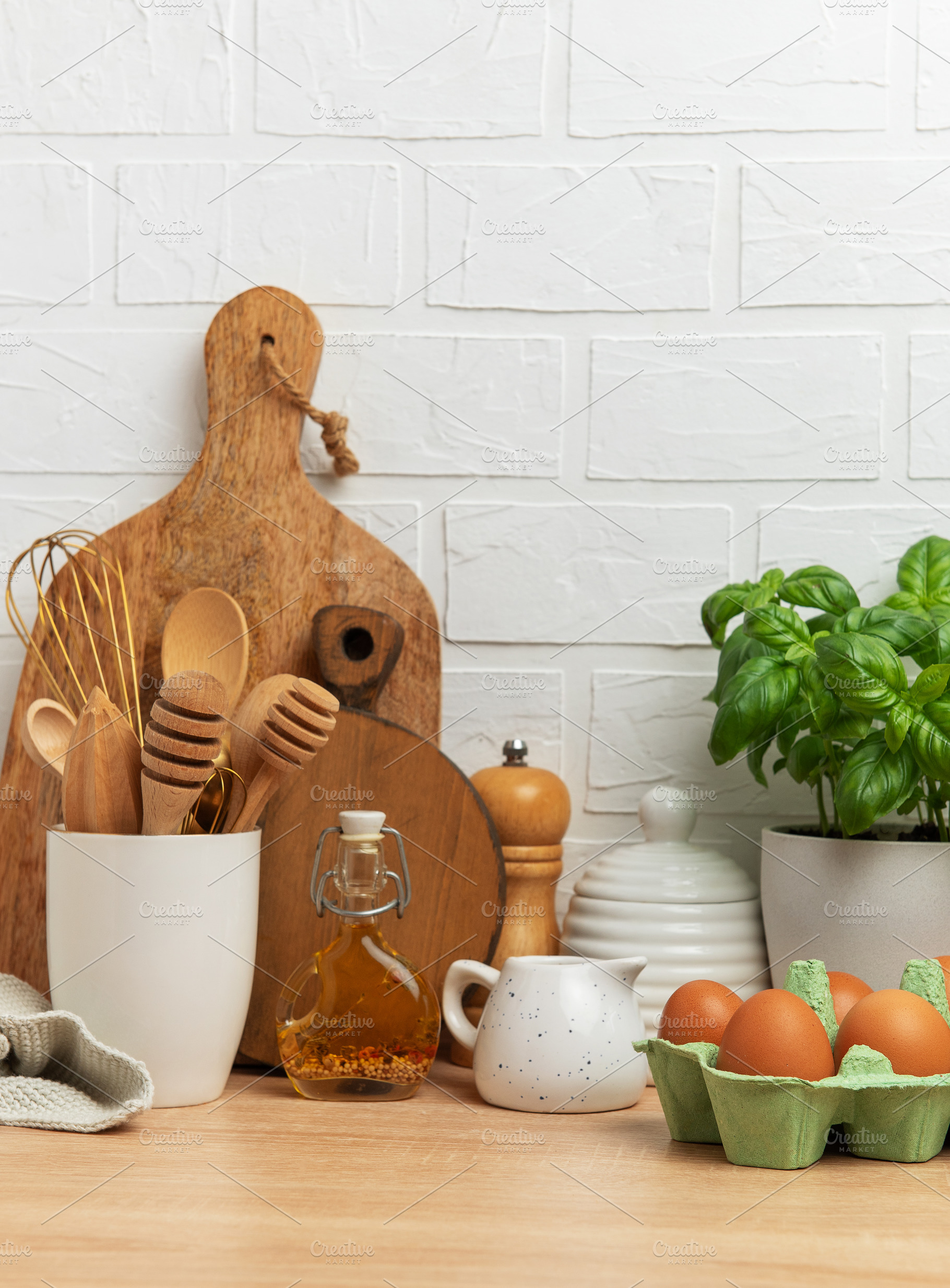 Kitchen utensils, eggs, and basil creating a rustic culinary sce, a Food & Drink Photo by Olena Rudo