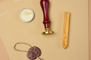 A wax seal kit including wax sticks, candles, stamp and sealed s, an Abstract Photo by ndanko