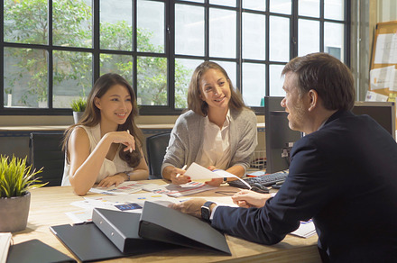 A group of multi ethnic business team talk, communicate, discuss, a Photo by Tampatra
