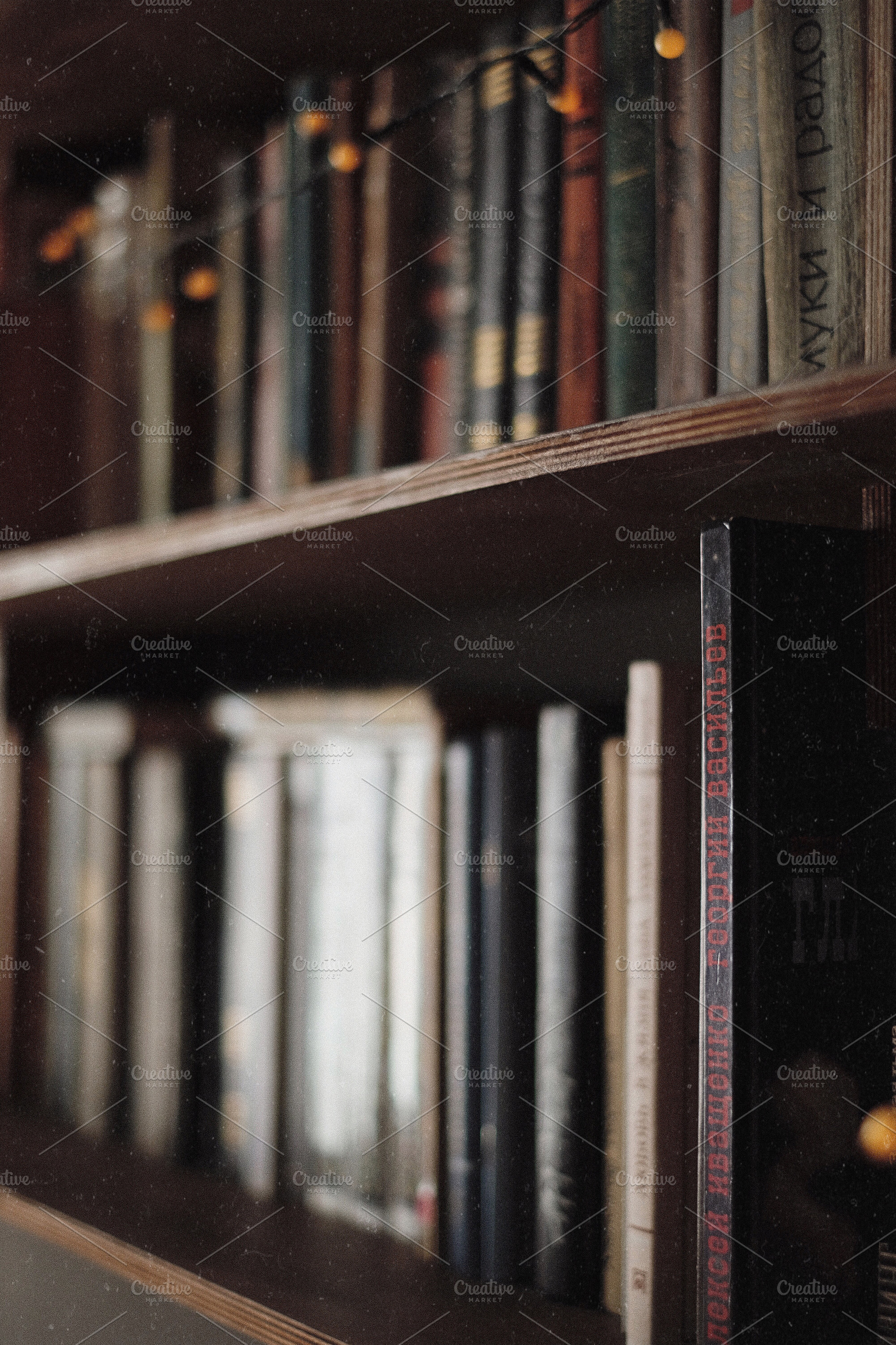 Vintage bookshelf with old books stock photo containing bookshelf and book, an Arts & Entertainment Photo by so_lizaveta