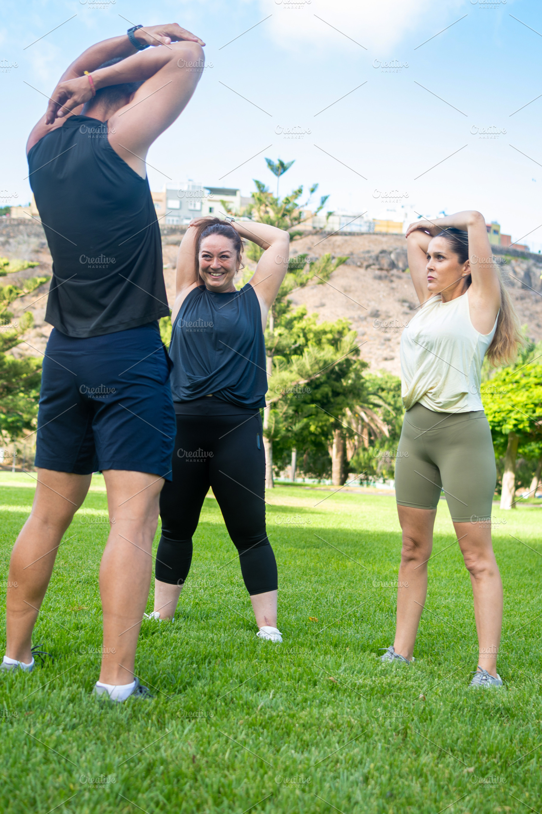 Fitness friends stretching before an outdoor workout, a Sports & Recreation Photo by etorres69