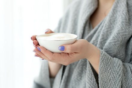 woman with a cup of hot drink