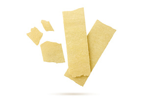Long potato chips and pieces flying