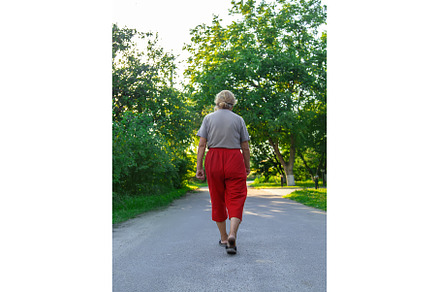 grandma is walking down the road, a Person Photo by yanadjana