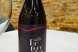 Bottle of red wine on white tablecloth with glass, a Food & Drink Photo by DanFLCreativo