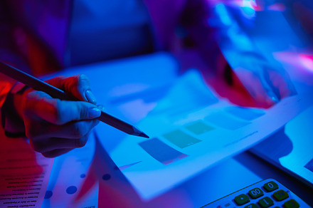 Closeup on modern woman with documents working with graphs, a Technology Photo by Alliance Images