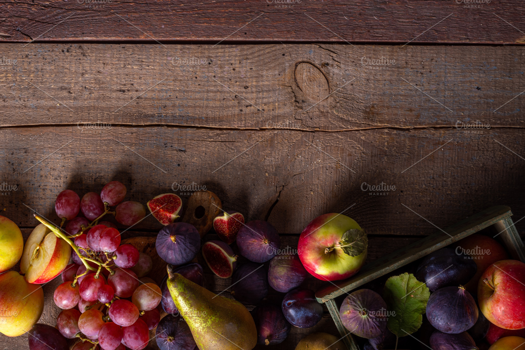 Autumn fruit assortment on wooden background, a Food & Drink Photo by Rimma