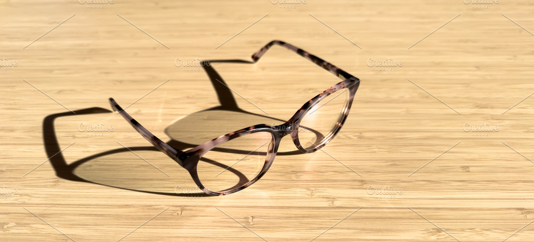 Eye Glasses On Wood With Copy Space, a Health & Medical Photo by THP Creative