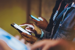 Friends using in hands mobile phone stock photo containing people and blogger