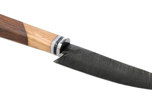 Knife with a dark, textured blade and a wooden handle featuring, a Food & Drink Photo by ndanko