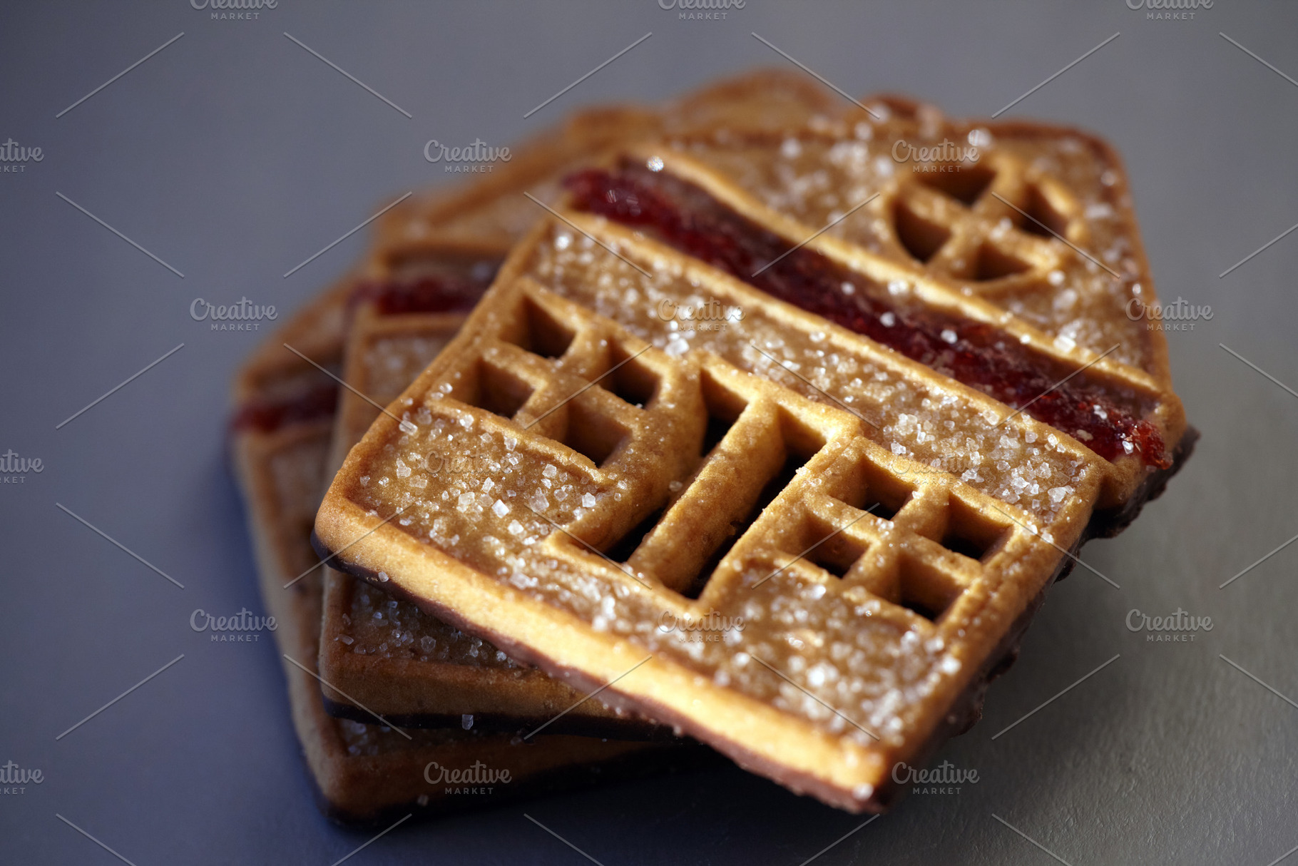 Sweet house-shaped cookies decorated with sugar and red fruit jam., a Food & Drink Photo by Rohan Photography