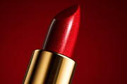 Red shimmering lipstick tube presenting glamour and elegance for, a Beauty & Fashion Photo by Studio ANNA (Thumbnail 2 of 2)