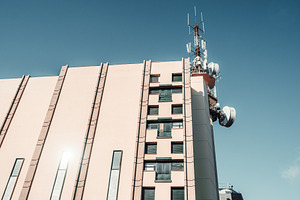 Building with rooftop antennas, an Architecture Photo by SkyNext