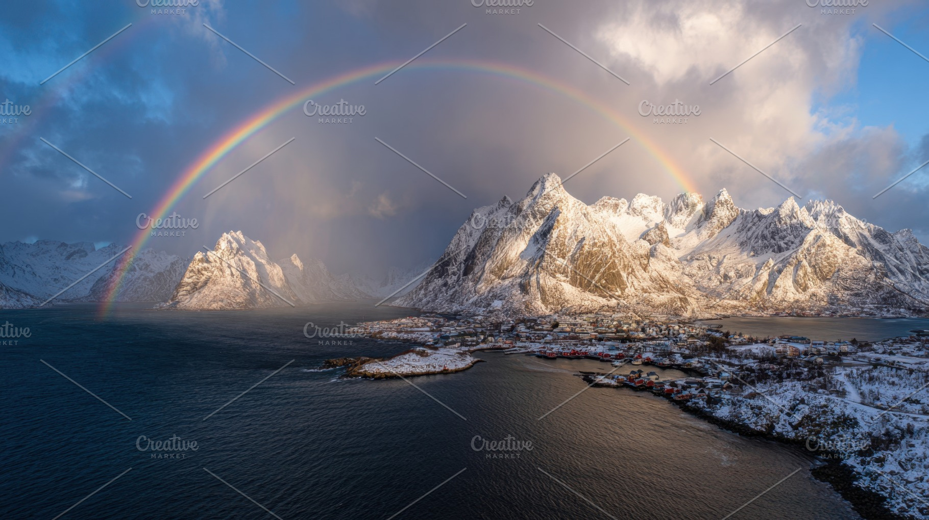 Rainbow over snowy mountains and sea, a Photo by Beautiful things