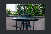 Outdoor Cafe Table and Wicker Chair, a Background Photo by AMMi (Thumbnail 3 of 3)
