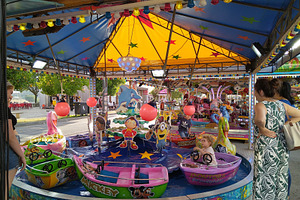 Mothers watching children at merry-go-round, an Arts & Entertainment Photo by DanFLCreativo