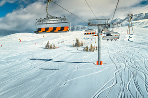 Famous ski slopes with cable cars, a Nature Photo by Alpine Dreams