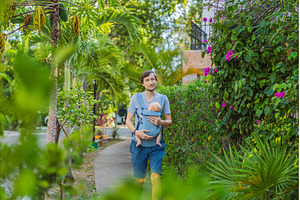 Young father walks in nature with, a Person Photo by Elizaveta Galitskaya