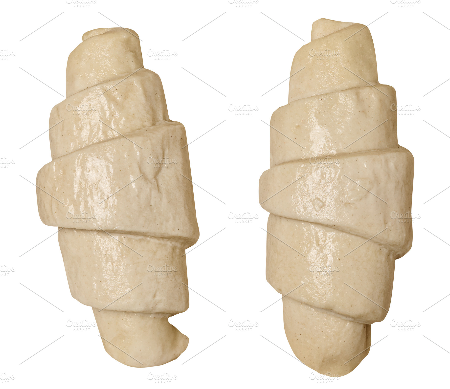 Raw croissant blanks on isolated background, top view, a Food & Drink Photo by ndanko
