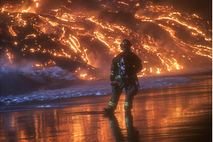 A man is standing on the beach as a, a Nature Photo by ZinetroN