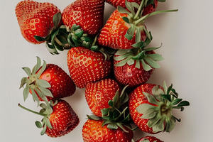 A vibrant collection of ripe strawbe, a Photo by LOGOCREATIVE