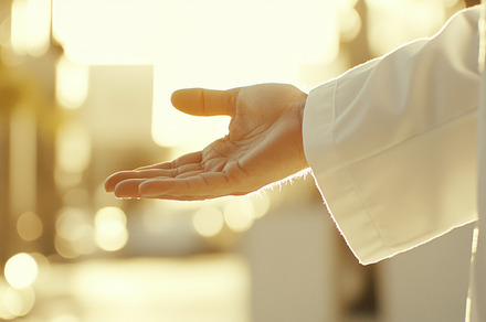 Hand of Jesus reaching out with light in spiritual scene, copy s, a Photo by Dvoevnore photos