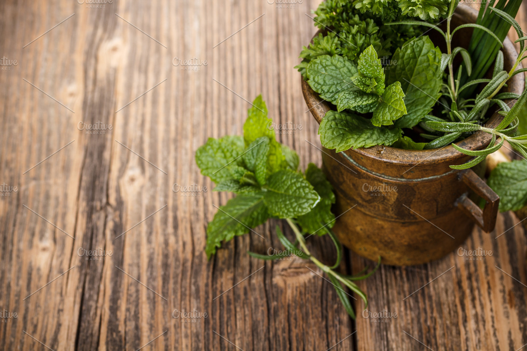 Mortar with herbs containing herb, spice, and mint