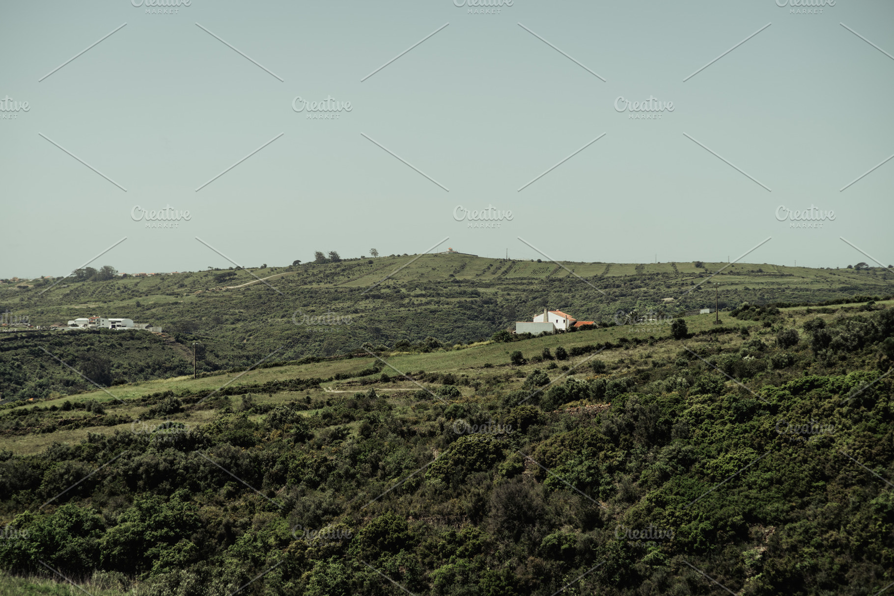 Green hills with distant farmhouse, an Architecture Photo by SkyNext