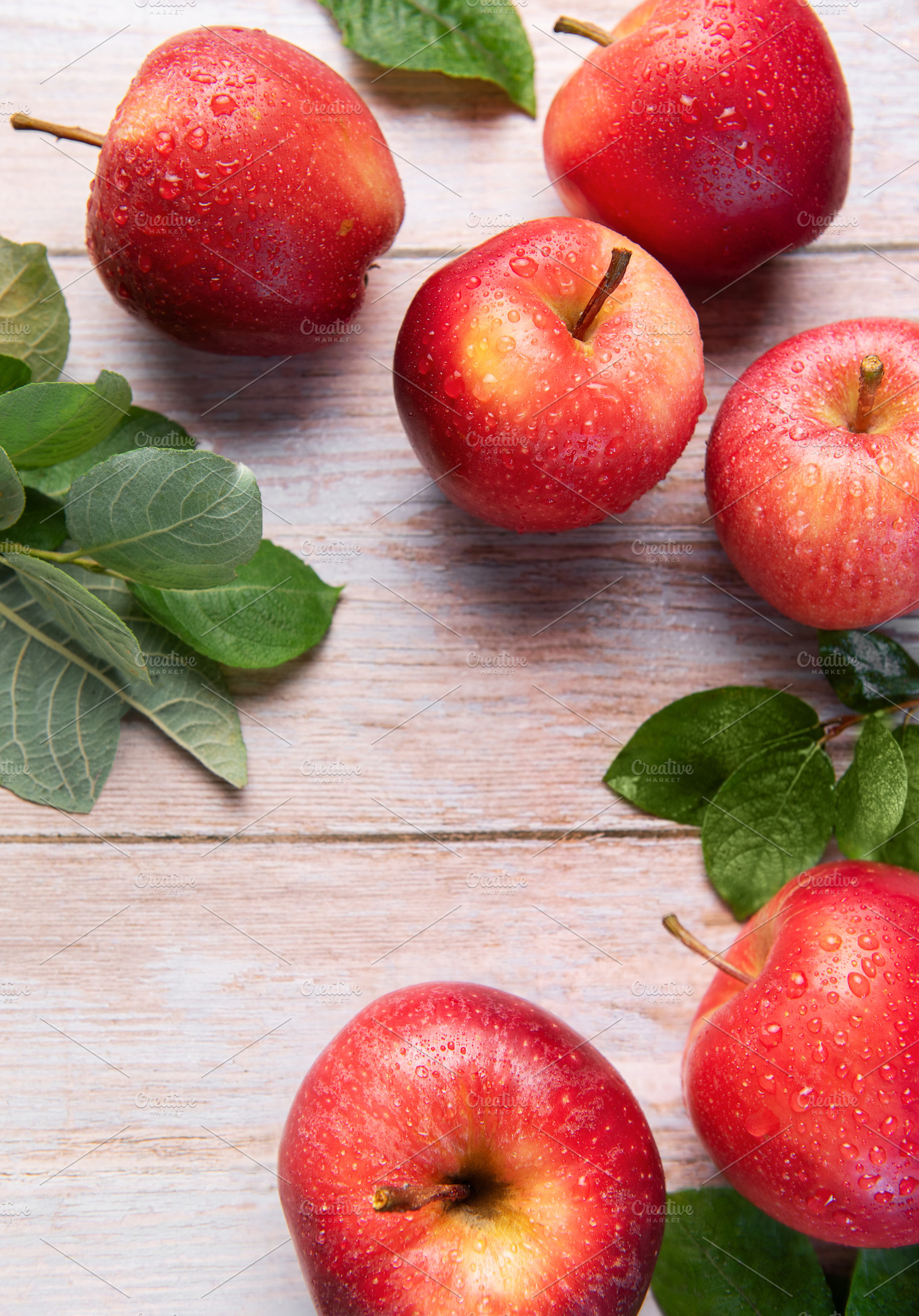Fresh red gala apples with green lea, a Food & Drink Photo by Olena Rudo