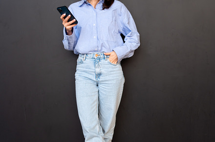 Woman use smartphone Full length, a Photo by andreonegin market
