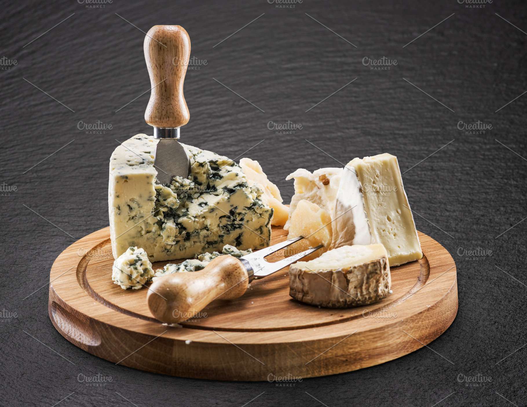 Cheese board with soft cheeses, a Food & Drink Photo by Volff