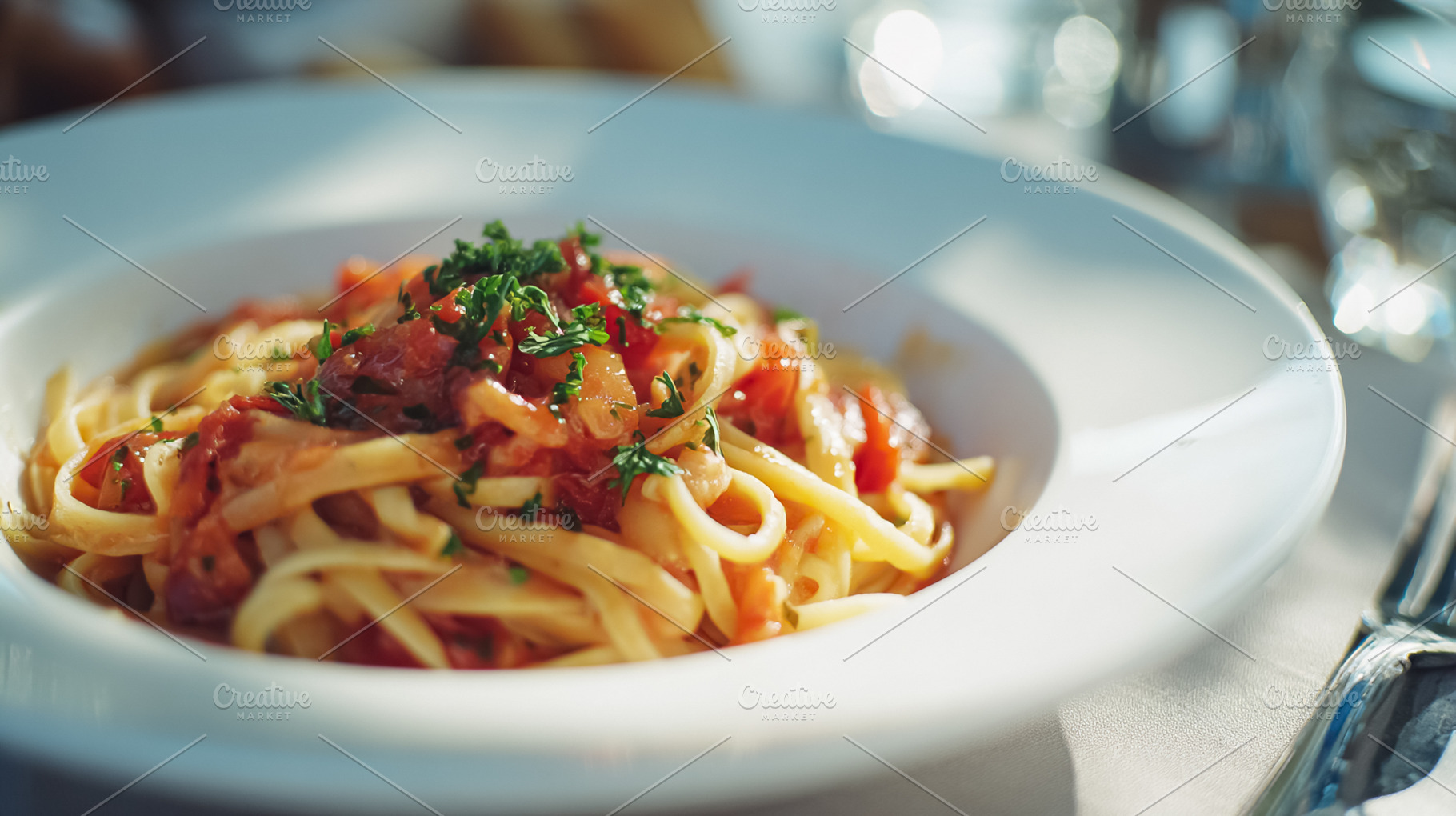 Linguine pasta dish with fresh tomato sauce and parsley, an auth, a Photo by Studio ANNA
