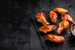 Mouthwatering BBQ chicken wings, coated in a rich sauce, perfect, a Food & Drink Photo by composter-box@mail.ru