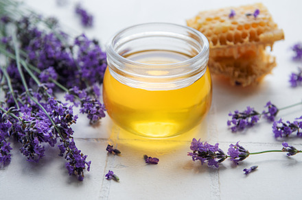 Jar with honey and fresh lavender flowers, a Food & Drink Photo by Olena Rudo