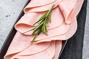 Gourmet sliced ham on a rustic board, inviting you to explore de, a Food & Drink Photo by composter-box@mail.ru