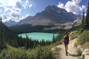 Hiking towards a turquoise lake surr, a Photo by Tanuart