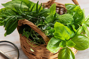 Fresh herbs harvest in basket with garden scissors, a Food & Drink Photo by Olena Rudo