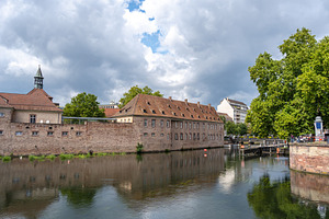 Historic building by the river in Strasbourg, France, an Architecture Photo by GoodGoods